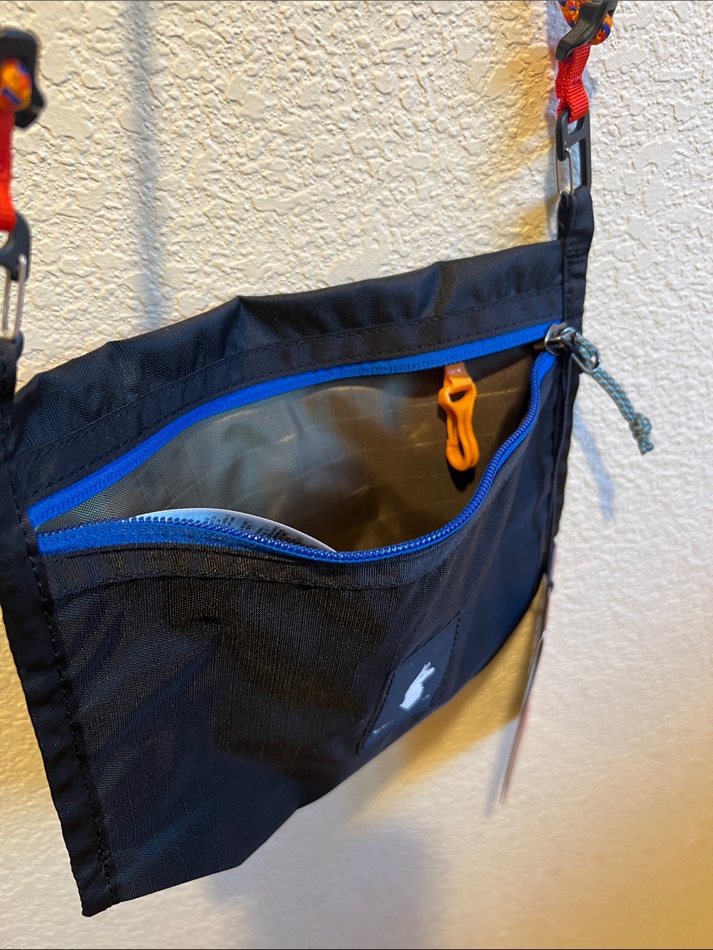 cotopaxi Black Crossbody Bag with Blue Zip and Orange Strap Accents - Picture 3 of 5